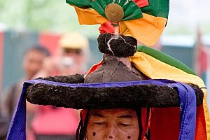 Black hat performer at Dak Thok Festival. Image by Mr & Mrs Hull