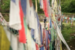 Prayer flags, cycling in Bhutan