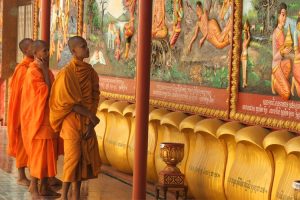 Monks looking at painting, Siem Reap