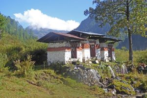 Water-driven prayer wheels on trail