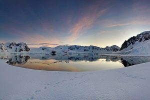 Sunset over the icy Antarctic landscape