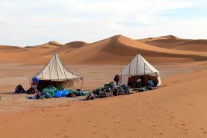 Setting up camp among the sand dunes